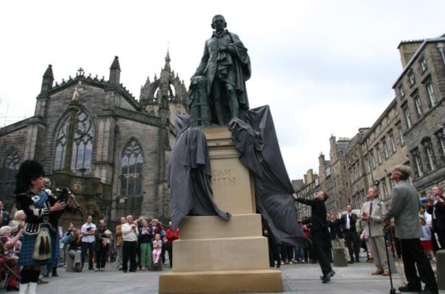 Statue of the Scottish economist Adam Smith and The Invisible Hand